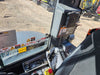 Kubota excavator cab interior with operator seat and controls