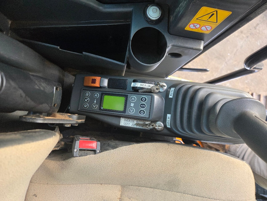 Rear three-quarter view of 2019 Sumitomo SH145X-6 excavator with steel tracks