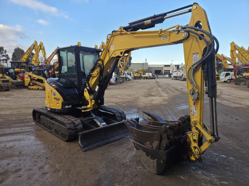 Compact tracked excavator side view
