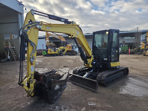 Tracked excavator with bucket